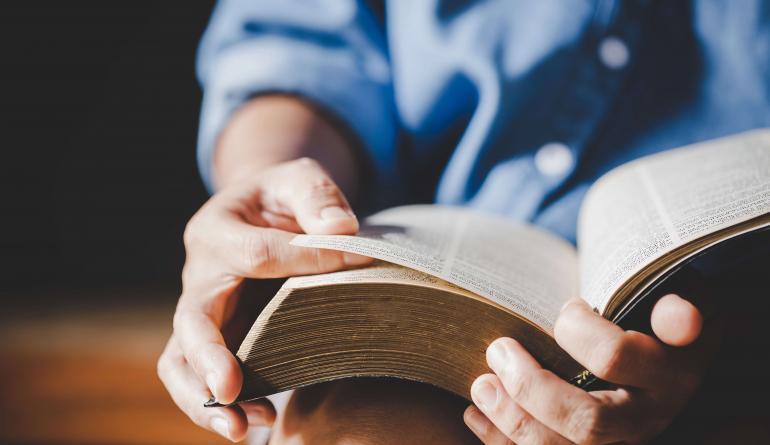 man reading bible