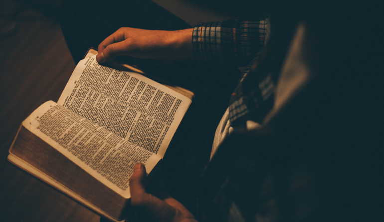 man reading bible